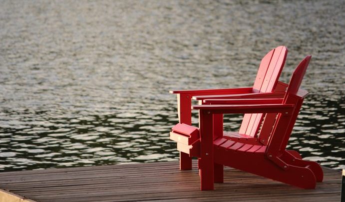 red chair near lake