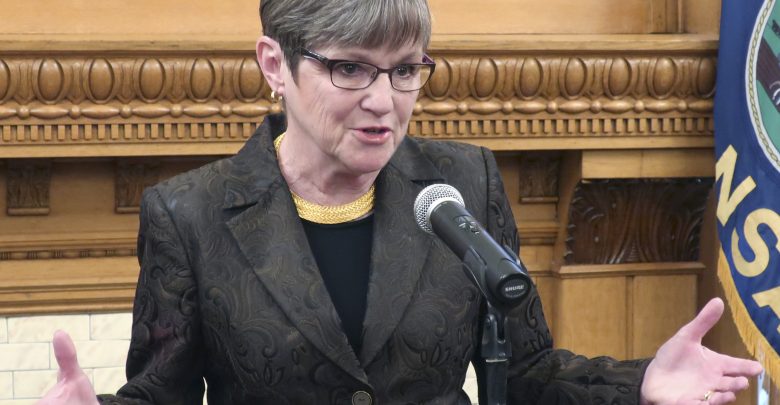 Kansas, Governor Laura Kelly, Medicaid, protst, banners, blood on their hands, Kansas Statehouse