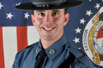 Photo of Trooper named State Employee of the Month for unique handling of traffic stop