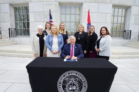 Governor Mike Parson signed two bills Thursday that will support Missouri’s adoptive families