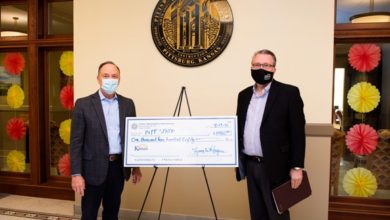 Photo of State Treasurer presents unclaimed property check to PSU 