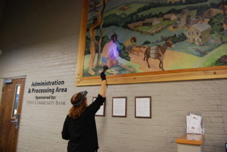 The restoration of Neosho’s “Centennial Mural” has been completed