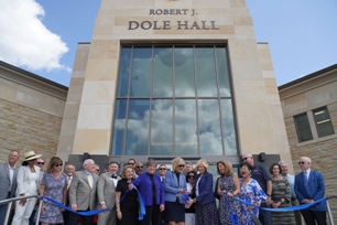 Photo of Gov. Laura Kelly cuts ribbon on Washburn University building dedicated to Senator Bob Dole