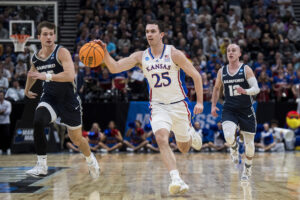 Jayhawks get friendly late whistle to adv...