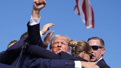 Photo of Trump is fine after shooting at rally, campaign says. Prosecutor says gunman and 1 attendee are dead