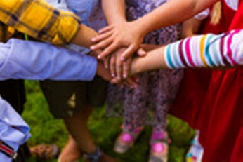 Kids Standing In The Circle And Joining Hands Together